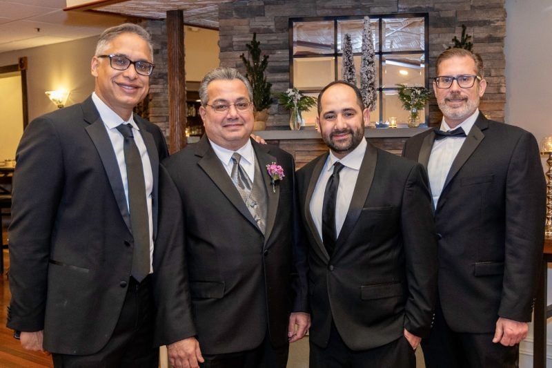 Suffolk Oral Surgery Doctors posing in professional gear